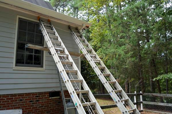 Ladder rig used to reach damaged area.